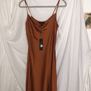 Donna Karan size 2 dress. Featuring a cowl neck, a side slit, brick color.